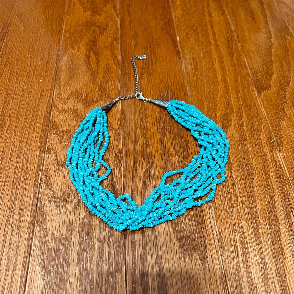 Turquoise Colored Layered string necklace with silver details
